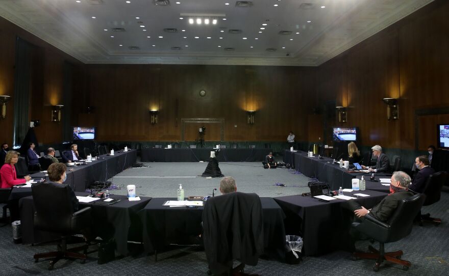 Some senators were in the briefing room for the hearing, while others and the four witnesses joined remotely.