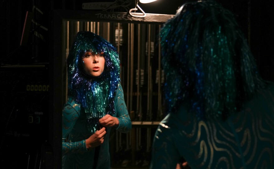 <a href="https://abigailmariecurran.com/">Abigail Marie Curran</a> checks herself in the mirror before going onstage to play punk rocker Storm Cloud in Opera Lafayette's production of <em>Io</em>.