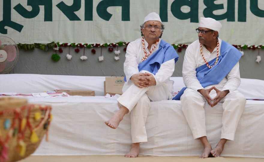 Indian historian Ramachandra Guha (left) speaks with Anamik Shah, the vice chancellor of Gujarat Vidyapith, a university founded by Mahatma Gandhi in 1920, in Ahmedabad, western India.