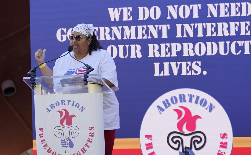 Michelle Colon, co-founder and executive director of SHERO, reminds the audience that the government "need not interfere in the reproductive lives of women," during an abortion rights rally in Smith Park in Jackson, Miss., Wednesday, Dec. 1, 2021.