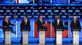 Republican presidential candidates (L-R) U.S. Rep. Ron Paul (R-TX), Texas Gov. Rick Perry, former Massachusetts Gov. Mitt Romney, former CEO of Godfather's Pizza Herman Cain and former Speaker of the House Newt Gingrich participate in a debate at Constitution Hall November 22, 2011 in Washington, DC. 