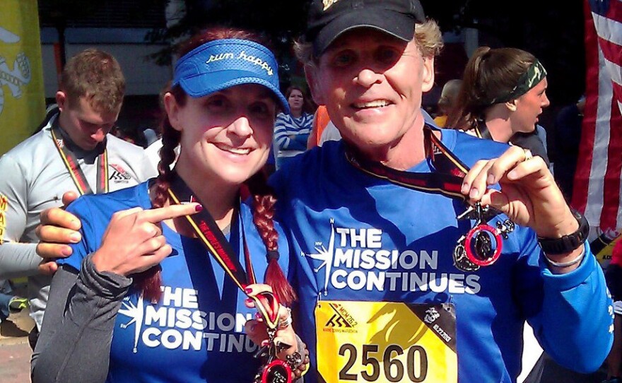 Demi Clark and her father, Howard Kympton, celebrate after running the Marine Corps Marathon in October. A family proud of its military heritage, they ran in support of an organization called The Mission Continues that matches veterans with service projects in the United States. Demi's brother Spencer Kympton helps run the charity.