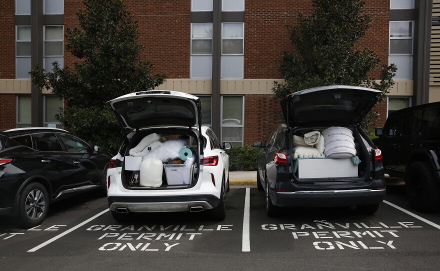 Students pack their belongings back into cars at Granville Towers, where one of the first clusters of positive coronavirus cases was <a href="https://alertcarolina.unc.edu/notifications/2020/08/14/cases/">reported on Aug. 14</a>.
