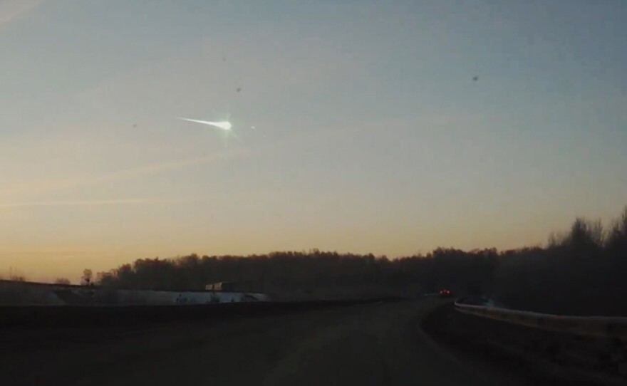 Dashboard camera image of first glimpse of meteor burning up as it enters atmosphere.