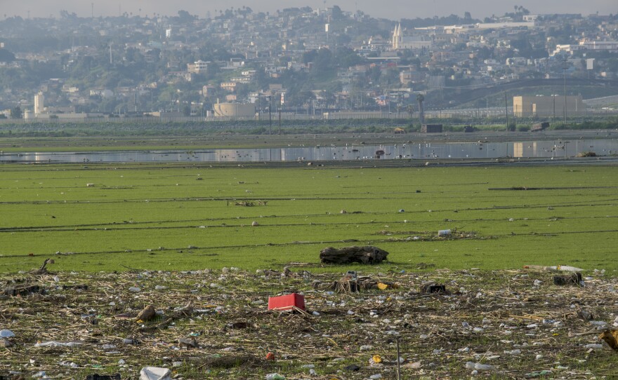 Trash and other debris piles up along the banks of the Tijuana River just after it flows into San Diego from Mexico on March 11, 2024.