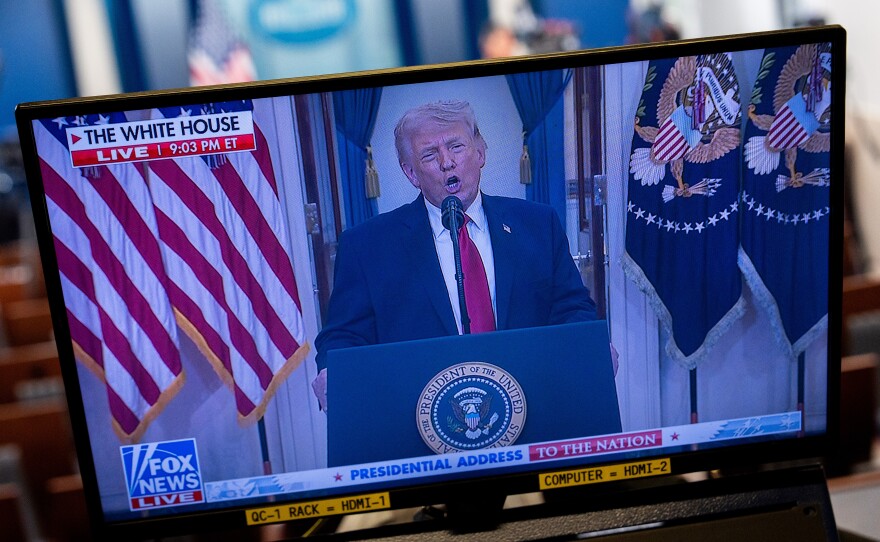 President Trump is seen speaking about the Iran war on a TV in the White House on April 1. Polls have found the war to be unpopular with Americans.