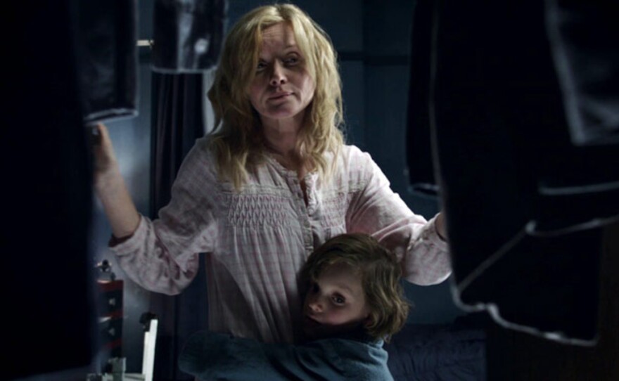 Amelia (Essie Davis) tries to comfort her son Samuel (Noah Wiseman) after she reads him a scary story in "The Babadook," the Day 16 selection in this month of horror.