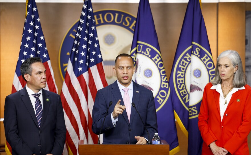 House Minority Leader Hakeem Jeffries, D-N.Y., speaks at a news conference after the House passed a short-term funding bill on Saturday, joined by House Minority Whip Katherine Clark, D-Mass., and Rep. Pete Aguilar, D-Calif., chair of the House Democratic Caucus.
