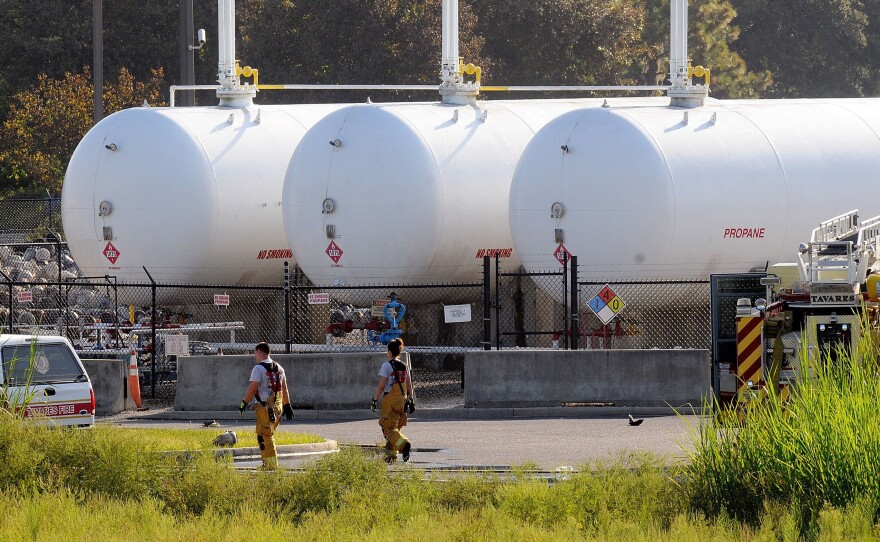 Propane cylinders sit on the grounds of Blue Rhino, a propane gas company, in Tavares, Fla. In the Midwest, farmers needed more propane for crops that came in later than normal.
