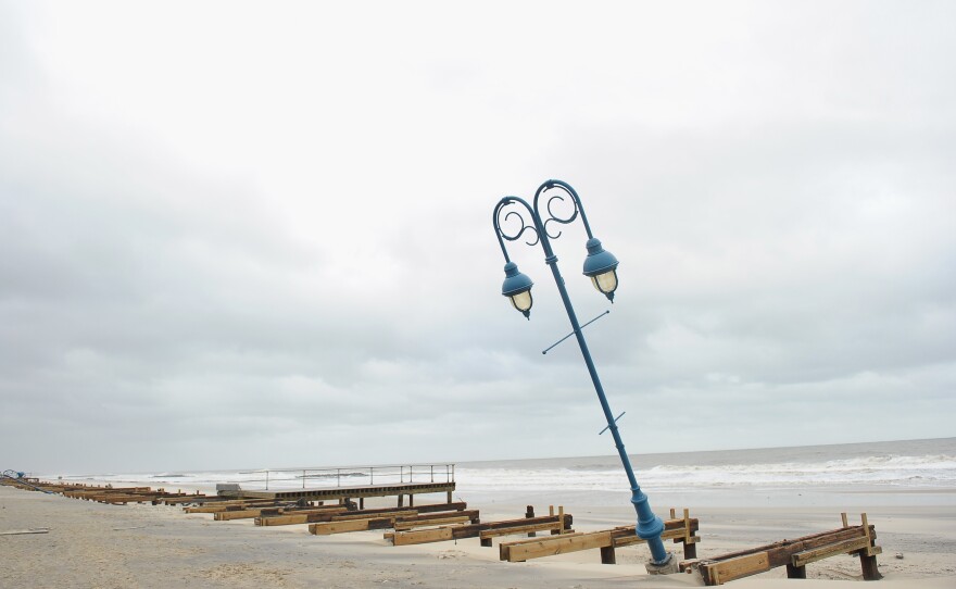What remains of the 1.2-mile boardwalk sits on the beach on Oct. 30 in Belmar, N.J.