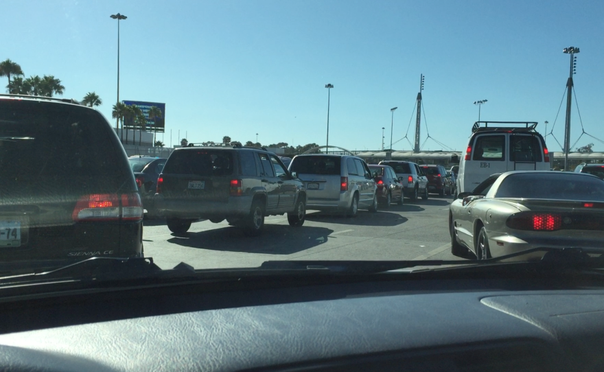 Bridget Bohorquez records the long line at the San Ysidro Port of Entry during a routine crossing, July 22, 2016. 