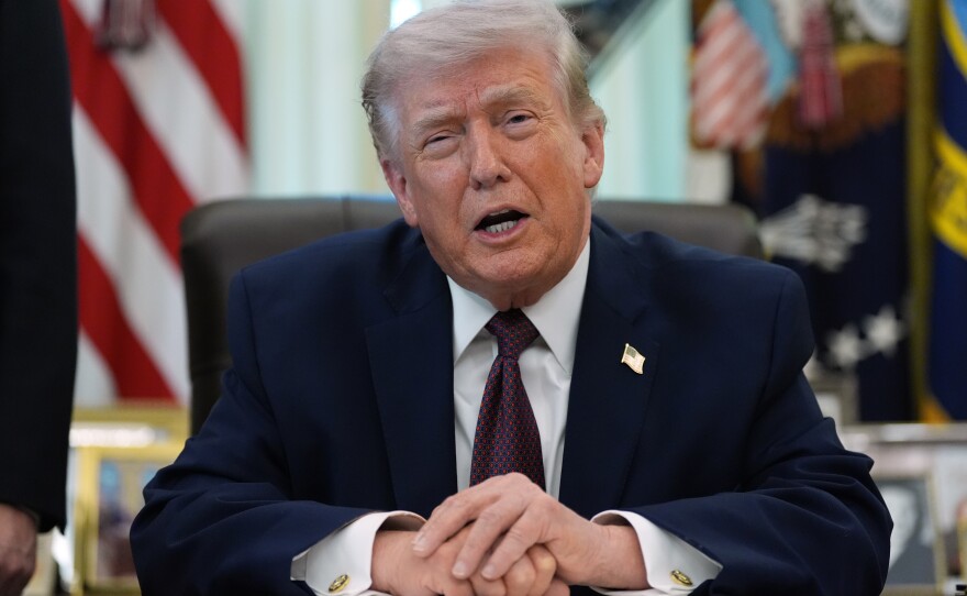 President Donald Trump speaks in the Oval Office of the White House before signing an executive order Tuesday, March 31, 2026, in Washington.