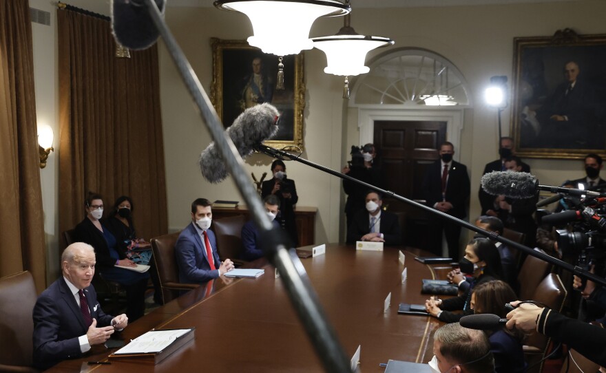 President Biden planned to talk about infrastructure on the anniversary of his inauguration. But first, he had to clean up some comments he had made about Russia and Ukraine.