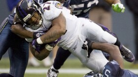 Baltimore Ravens running back Ray Rice is gang tackled by Seattle Seahawks