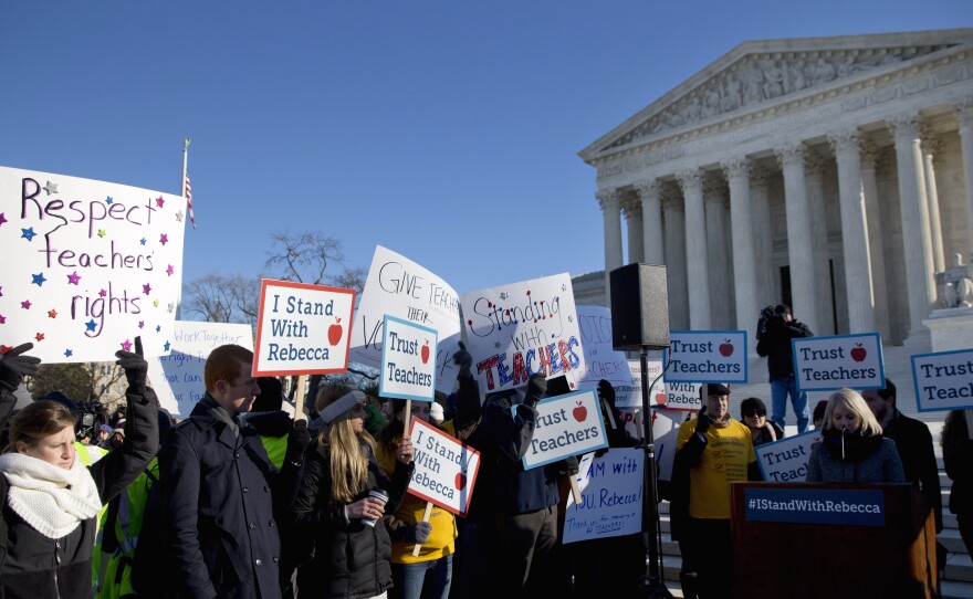 People rally at the Supreme Court in Washington in January, as the court heard arguments in Friedrichs v. California Teachers Association.
