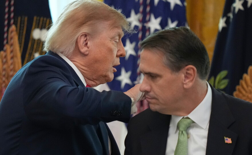President Donald Trump walks past Attorney General Todd Blanche after speaking at a roundtable event in the East Room of the White House, Wednesday, Oct. 21, 2026, in Washington.