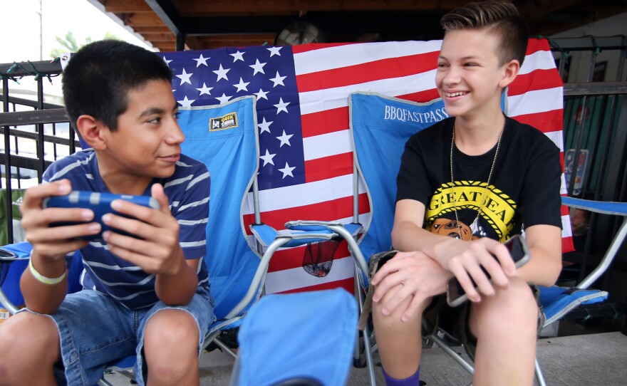 Desmond Roldan (right) is the 13-year-old behind BBQ Fast Pass, the line-sitting service. He's pictured here with his friend, Jiovani Acosta, on July 3, 2015.