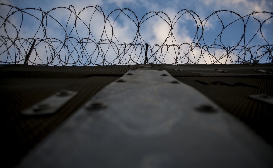 Stretches of secondary fencing are topped with spirals of concertina wire along the U.S.-Mexico border between the San Ysidro and Otay Mesa ports of entry, in San Diego on Aug. 16, 2017. Border Patrol agents use the frontage road between this and primary fencing to patrol for immigrants attempting to enter the U.S. illegally.