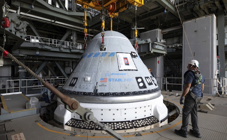 In this photo provided by NASA, the Boeing Starliner spacecraft is lifted for mounting on a United Launch Alliance Atlas V rocket at Cape Canaveral Space Force Station in Florida on Tuesday, April 16, 2024.