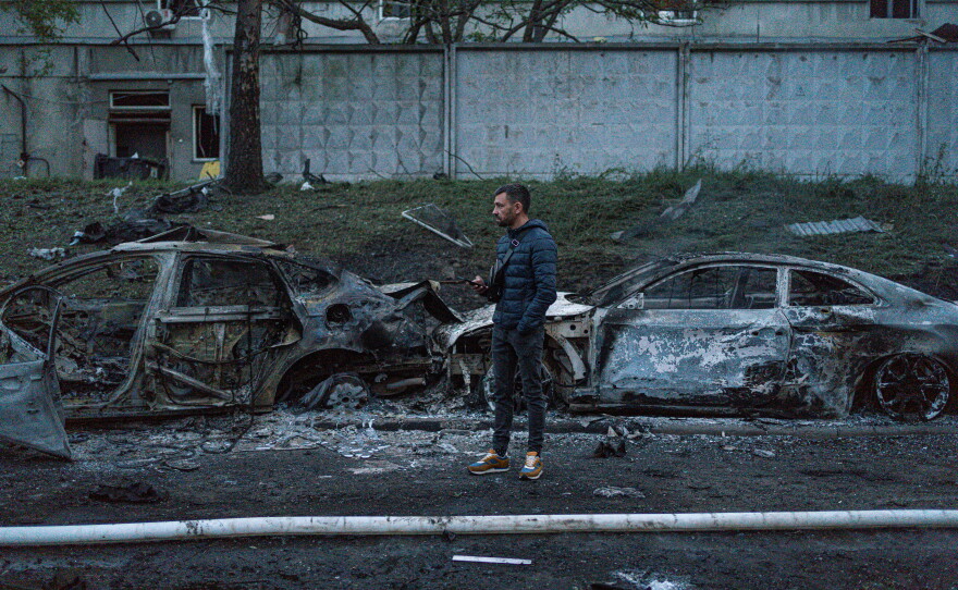 Damage is seen on a Kyiv street after one of Russia's largest aerial assaults on Ukraine in recent months.