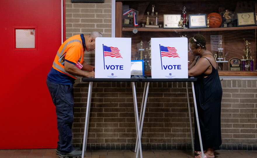 People vote in the primary election at Northwestern High School in Detroit, Tuesday.