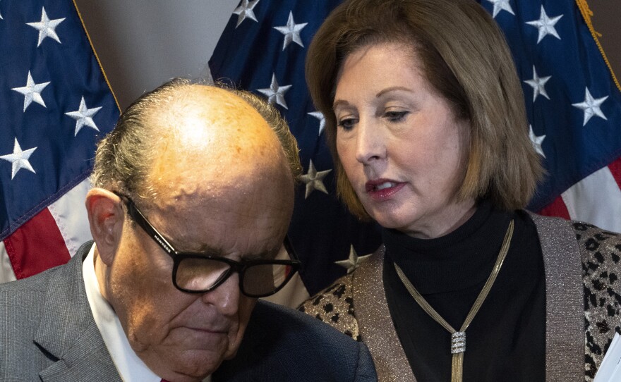 Rudy Giuliani, President Trump's personal attorney, with lawyer Sidney Powell last month in Washington. They, the Trump campaign and others face a lawsuit by an employee of Dominion Voting Systems, a vendor that has been the subject of disinformation from Trump and his allies.