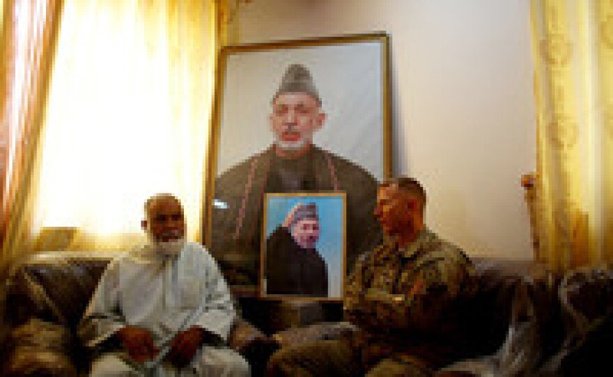 Panjwai District Gov. Haji Faizal Mohammad meets with U.S. Army Col. Douglas Sims. U.S. troops pushed the Taliban out and stabilized the region and Afghan forces are now in control of the territory in the southern province of Kandahar.