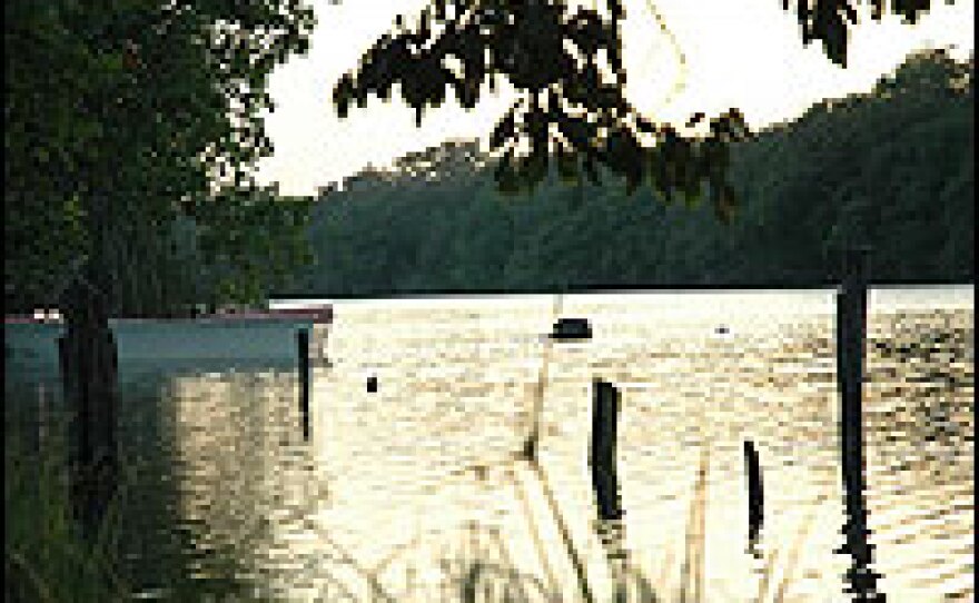 A canoe sits on the Rio Hondo River, which runs between Mexico and Belize. Villagers in a border town say goods and people – including many Chinese hoping to make it to America — are smuggled into Mexico from Belize.