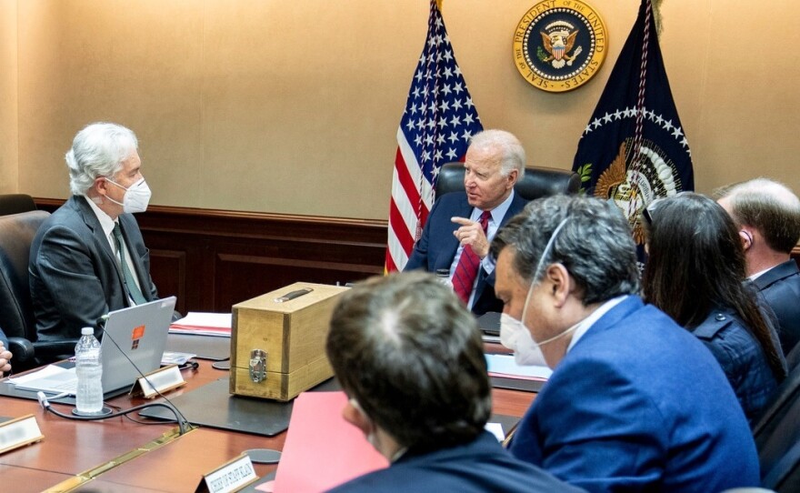 President Biden meets with his national security team on July 1 to discuss the drone strike that killed al-Qaida leader Ayman al-Zawahiri on July 31. The wooden box in front of the president contains a replica of the house where al-Zawahiri was living in Kabul, Afghanistan.