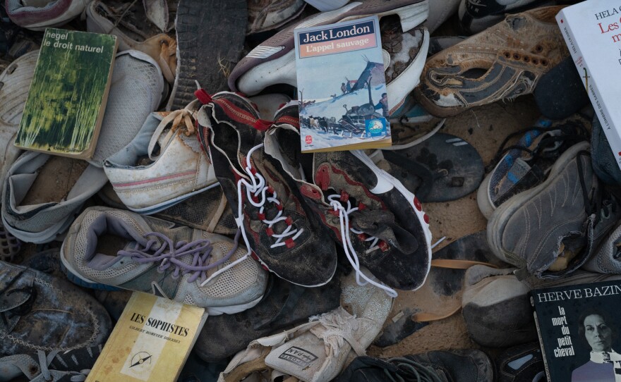 A pair of red and black Nike sneakers, size 45, that Lihidheb found just after a boat sank off the coast with 18 Tunisians onboard.