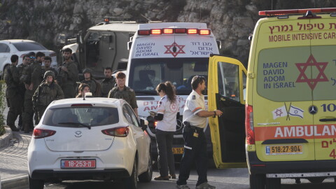 Israeli soldiers and emergency personnel gather near ambulances following a shooting attack near Yehuda Junction, near Hebron, in the occupied West Bank, Friday, Oct. 23, 2026.