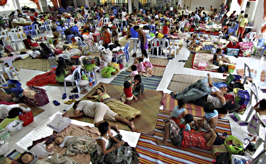 Hundreds of residents take shelter Friday inside the provincial capitol of Surigao city close to central Philippines in anticipation of typhoon Hagupit which is expected to hit land Saturday afternoon. About a year the country was lashed by Typhoon Haiyan, which left more than 7,300 people dead.