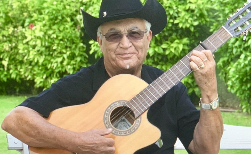 Eliades Ochoa playing guitar. (undated photo)