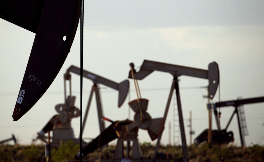 Pump jacks work in a field near Lovington, N.M., in 2015. The Trump administration is lifting an Obama-era rule aimed at limiting emissions of methane, a potent climate-warming gas.