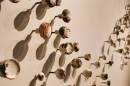 San Diego artist Kline Swonger's sculptural installation, "A Place Called Home" includes 117 door knobs. It's part of the exhibition "Four Visions: A Celebration of the Year of the Woman," on the walls of the currently-closed Cannon Gallery in Carlsbad.