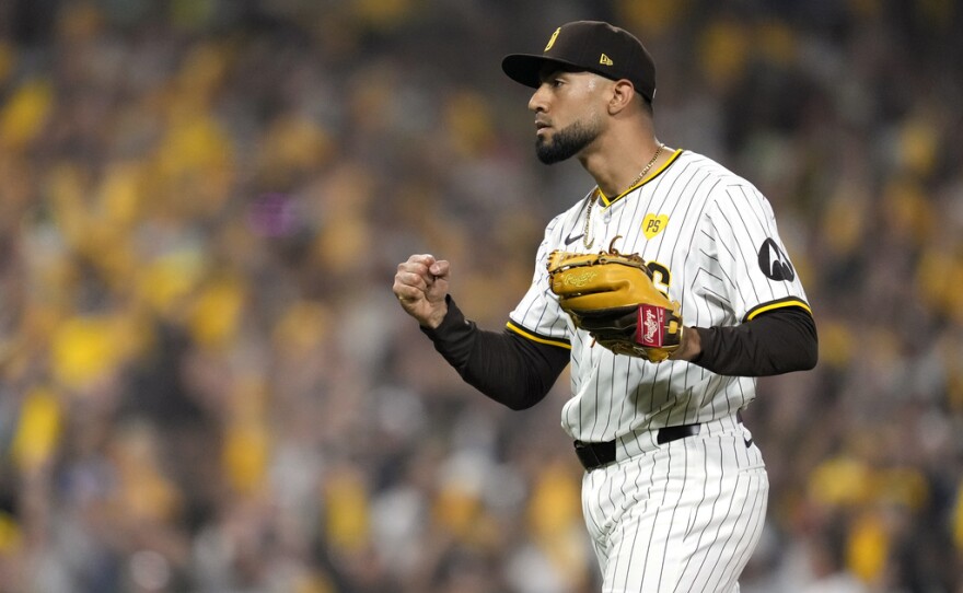 San Diego Padres pitcher Robert Suarez reacts after recoding the last out of the game in a win over the Los Angeles Dodgers in Game 3 of a baseball NL Division Series Tuesday, Oct. 8, 2024, in San Diego.