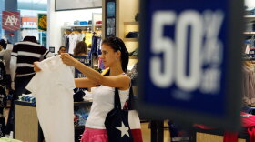 A shopper browses clothing at an Aeropostale store in Paramus, N.J.  For retailers, the back-to-school shopping season is the second most important of the year, after Christmas.