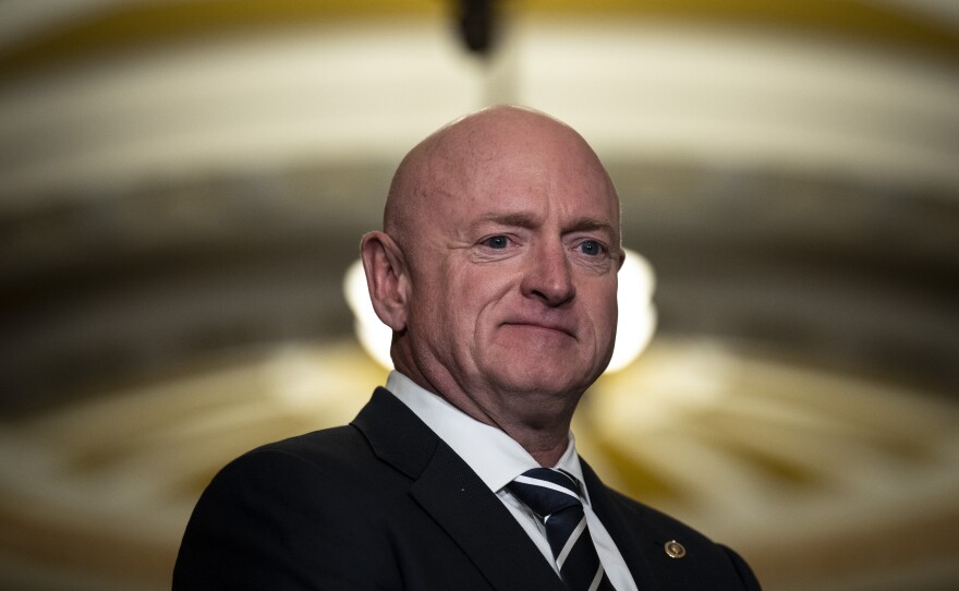 Sen. Mark Kelly (D-AZ) waits to speak during a news conference following a closed-door lunch meeting with Senate Democrats at the U.S. Capitol March 22, 2023 in Washington, D.C.