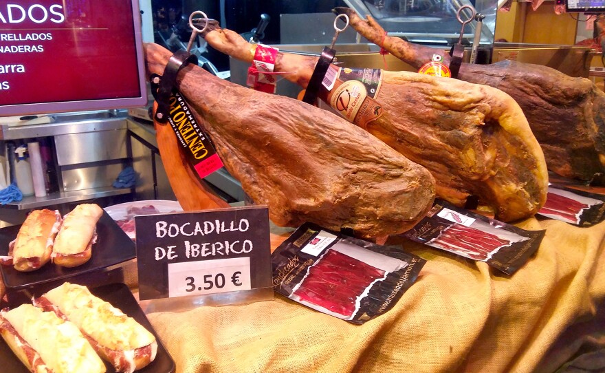 Display of Spanish hams in the front window of a branch of the Museo del Jamón, a chain of ham-themed bars in Madrid.
