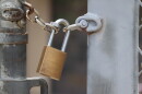 A padlock secures a fence at a school in Santee on Wednesday, Aug. 5, 2026.