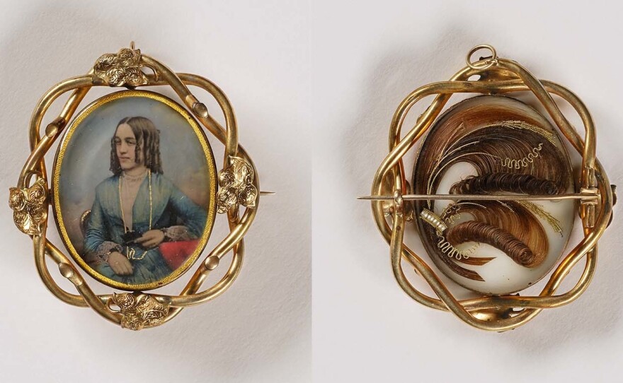 Unidentified artist, <em>Untitled (pin/pendant, woman with curls; verso, with sculpted hair)</em>, 1853, daguerreotype in metal setting. Smithsonian American Art Museum, the L. J. West Collection of Photographic Jewelry, Museum purchase made possible through the Franz H. and Luisita L. Denghausen Endowment.