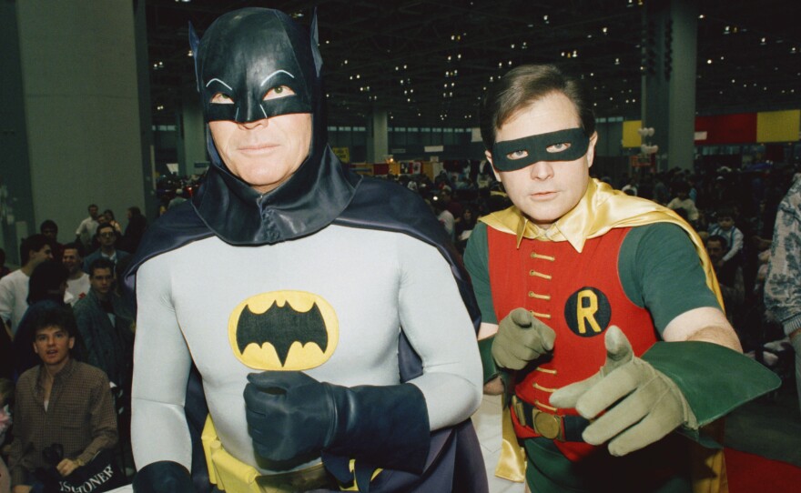 Actors Adam West (L)and Burt Ward dressed as their characters (Zappp!) "Batman" and (Powww!) "Robin," on Jan. 27, 1989 at the "World of Wheels" custom car show in Chicago.