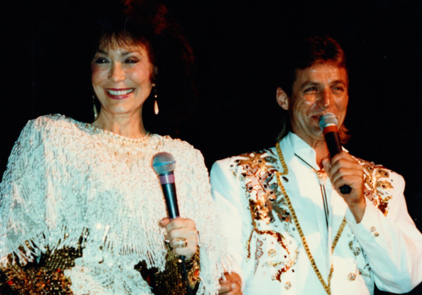 Loretta Lynn and her son Ernest Ray Lynn performing.