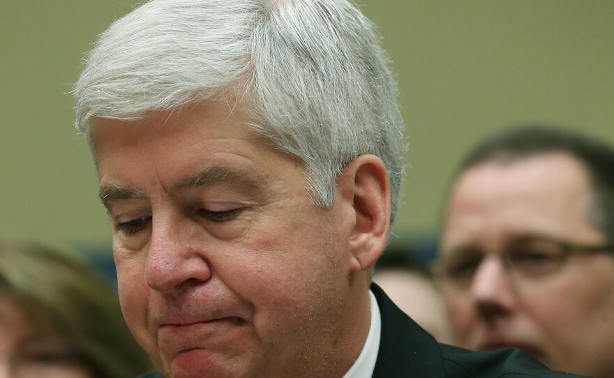 Now Former Michigan Gov. Rick Snyder, (R-MI), listens to Congressional members remarks during a House Oversight and Government Reform Committee hearing, about the Flint, Mich. water crisis in 2016.