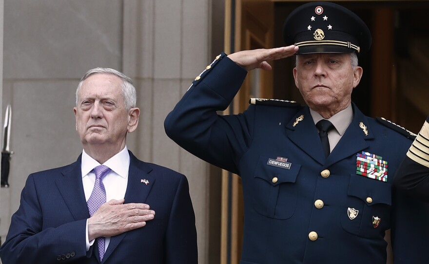 Former Mexican Defense Secretary Gen. Salvador Cienfuegos, right, with former U.S. Defense Secretary Jim Mattis at the Pentagon in 2017. Cienfuegos was arrested on a DEA warrant at Los Angeles International Airport Thursday.