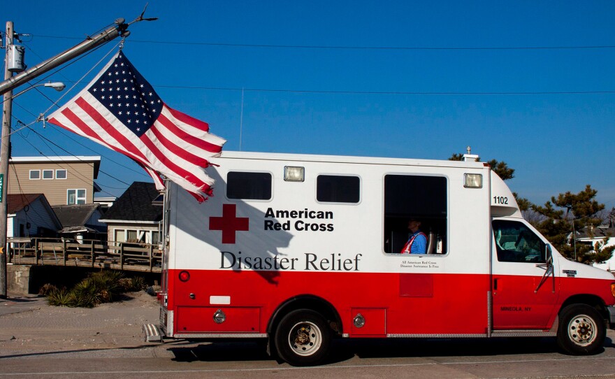 In the aftermath of Superstorm Sandy, a former Red Cross official says as many as 40 percent of the organization's emergency vehicles were assigned for public relations purposes. This photo, which shows one of their trucks in Long Island, N.Y., in January 2013, is one example of the many publicity photos taken by the Red Cross.