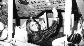 Margaret Hamilton sits in mock-up of Apollo the command module on display  at MIT in 1969.