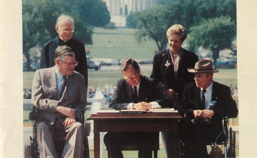 The September issue of Mainstream Magazine in 1990, shows President George H.W. Bush signing the Americans with Disabilities Act.