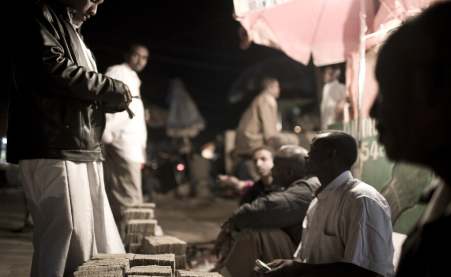 Men change money in central Hargeisa. Somaliland has its own currency — the Somaliland shilling. It takes stacks of shillings to equal one U.S. dollar, and piles of shillings are seen throughout the city, often transported by wheelbarrow. Theft in Somaliland is rare, and there are few reservations about having so much money out in the open.