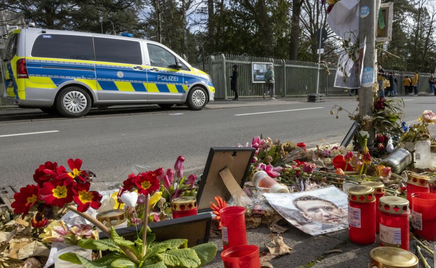 Flowers and candles are laid in front of the Russian Consulate General in memory of Alexei Navalny, in Bonn, Germany, on Sunday.